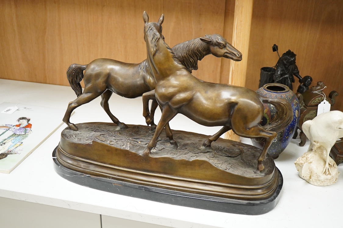 After Pierre-Jules Mêne (1810-1879), a large animalier bronze of two horses, raised on shaped base, 55cm wide